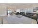 Open-concept living room showcasing marble floors, neutral decor, and comfortable seating at 2209 Purple Majesty Ct, Las Vegas, NV 89117