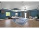 Large main bedroom with wood floors, recessed ceiling lights, and sitting area at 2209 Purple Majesty Ct, Las Vegas, NV 89117