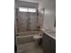 Bathroom featuring gray marble styled tile on the walls and floor at 3275 Arville St # C, Las Vegas, NV 89102