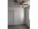 Bright bedroom features a ceiling fan and closet at 3275 Arville St # C, Las Vegas, NV 89102