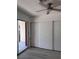 Bedroom with sliding door closet, and laminate flooring at 3275 Arville St # C, Las Vegas, NV 89102