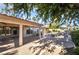 Beautiful backyard with covered patio, rock feature, safety fence, and a sparkling pool at 4176 Skywalker Ave, Las Vegas, NV 89120