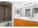 Bathroom with dual sinks and tile shower at 4176 Skywalker Ave, Las Vegas, NV 89120