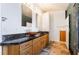 Bathroom with dual sinks, granite countertop, and tile flooring at 4176 Skywalker Ave, Las Vegas, NV 89120
