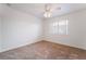 Bedroom featuring neutral carpet, a ceiling fan, and a window with blinds at 4176 Skywalker Ave, Las Vegas, NV 89120