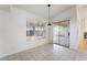 Bright dining area with tile floors, large window, sliding glass door to patio at 4176 Skywalker Ave, Las Vegas, NV 89120