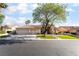 Charming single-story home featuring a well-maintained front yard, mature trees, and a spacious three-car garage at 4176 Skywalker Ave, Las Vegas, NV 89120