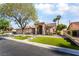 Attractive home featuring a well-manicured lawn, mature trees, and inviting front entrance at 4176 Skywalker Ave, Las Vegas, NV 89120