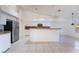 Bright kitchen featuring tile flooring, granite countertops, and modern appliances at 4176 Skywalker Ave, Las Vegas, NV 89120
