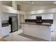 Open kitchen featuring white cabinets, stainless steel appliances, and granite countertops at 4176 Skywalker Ave, Las Vegas, NV 89120