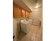 Well-equipped laundry room with washer, dryer, and ample cabinet space for storage, ensuring convenience at 4176 Skywalker Ave, Las Vegas, NV 89120