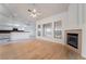 Open living space with fireplace, wood floors, and bright, natural light at 4176 Skywalker Ave, Las Vegas, NV 89120