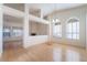 Bright and open living room featuring wood floors, high ceilings, and ample natural light at 4176 Skywalker Ave, Las Vegas, NV 89120