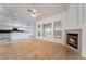 Open living space with fireplace, wood floors, and bright, natural light at 4176 Skywalker Ave, Las Vegas, NV 89120