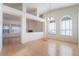 Bright and open living room featuring wood floors, high ceilings, and ample natural light at 4176 Skywalker Ave, Las Vegas, NV 89120