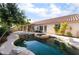 Backyard pool with patio, jacuzzi, desert landscaping, and enclosed outdoor area at 4176 Skywalker Ave, Las Vegas, NV 89120