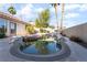 Backyard pool and patio featuring jacuzzi, desert landscaping, and home exterior at 4176 Skywalker Ave, Las Vegas, NV 89120