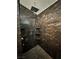 Walk-in shower with elegant marble walls and modern fixtures, creating a spa-like experience in your own home at 4176 Skywalker Ave, Las Vegas, NV 89120
