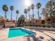 Well-maintained community pool surrounded by lush greenery and desert landscaping at 5220 Mission Carmel Ln # 101, Las Vegas, NV 89107
