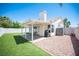 Outdoor space featuring a covered patio, desert landscaping, and ample area for outdoor activities at 7103 Shadow Crest Dr, Las Vegas, NV 89119