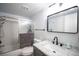 Bathroom featuring modern fixtures, sleek vanity, and a shower-tub combo at 7103 Shadow Crest Dr, Las Vegas, NV 89119