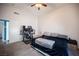A bedroom with a ceiling fan and a built-in desk is the perfect work from home setup at 7103 Shadow Crest Dr, Las Vegas, NV 89119