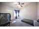 Bedroom includes closet, fan, and window that provides natural lighting at 7103 Shadow Crest Dr, Las Vegas, NV 89119