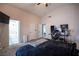 Spacious bedroom with a ceiling fan, carpet, and ensuite bathroom offers comfort and convenience at 7103 Shadow Crest Dr, Las Vegas, NV 89119