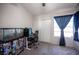 Cozy bedroom features built-in closet, natural lighting and modern fan at 7103 Shadow Crest Dr, Las Vegas, NV 89119