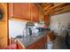 Organized garage with wooden cabinets, work bench, and peg board at 7103 Shadow Crest Dr, Las Vegas, NV 89119