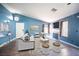 Bright living room features neutral palette, fireplace, and ample natural light, creating an inviting atmosphere at 7103 Shadow Crest Dr, Las Vegas, NV 89119