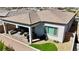 Aerial view of a backyard with covered patio and a grill at 8550 Lost Pony St, Las Vegas, NV 89148