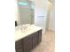 Bathroom featuring a single sink with a white countertop and a shower with sliding glass doors at 8550 Lost Pony St, Las Vegas, NV 89148