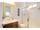 Contemporary bathroom featuring a glass shower enclosure, vanity with modern fixtures, and natural light at 8550 Lost Pony St, Las Vegas, NV 89148