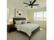 Comfortable bedroom features a large bed, side tables, modern decor, and bright natural light at 8550 Lost Pony St, Las Vegas, NV 89148