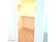 Small walk-in closet with carpet and a wooden bar shelf combo at 8550 Lost Pony St, Las Vegas, NV 89148