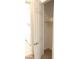 A small closet with white walls and a simple rod is located near laundry room at 8550 Lost Pony St, Las Vegas, NV 89148