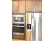 Modern kitchen appliances including stainless steel refrigerator, oven, and microwave at 8550 Lost Pony St, Las Vegas, NV 89148