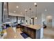 Granite countertops and stainless steel appliances highlight this kitchen's charm, paired with ample counter space on the large island at 8550 Lost Pony St, Las Vegas, NV 89148