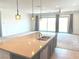 Gourmet kitchen island with granite countertops, seating, and an undermount sink at 8550 Lost Pony St, Las Vegas, NV 89148