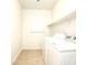 Bright laundry room with modern appliances, offering efficiency and functionality at 8550 Lost Pony St, Las Vegas, NV 89148