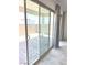 Sliding door with vertical blinds, opening onto a brick patio at 8550 Lost Pony St, Las Vegas, NV 89148
