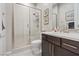 Modern bathroom features a glass-enclosed shower, elegant fixtures, and a stylish vanity with counterspace at 10018 Regency Square Ave, Las Vegas, NV 89148