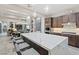 A gourmet kitchen with an island, seating, designer cabinets, and countertops, perfect for entertaining at 10018 Regency Square Ave, Las Vegas, NV 89148