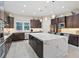 Spacious kitchen with stainless steel appliances and a large center island with bar stool seating at 10018 Regency Square Ave, Las Vegas, NV 89148