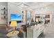 Open concept living room featuring a stone fireplace, modern furnishings, and access to the kitchen at 10018 Regency Square Ave, Las Vegas, NV 89148