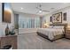 Spacious main bedroom with neutral tones, plantation shutters, and a comfortable bed at 10018 Regency Square Ave, Las Vegas, NV 89148