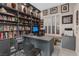 Well-lit office space with built-in bookshelves and a modern desk setup at 10018 Regency Square Ave, Las Vegas, NV 89148