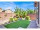Backyard with brick fence and small grassy area at 10976 Bluebell Basin Rd, Las Vegas, NV 89179