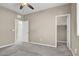 Bedroom featuring carpet flooring, ceiling fan, walk-in closet and ensuite bath at 10976 Bluebell Basin Rd, Las Vegas, NV 89179